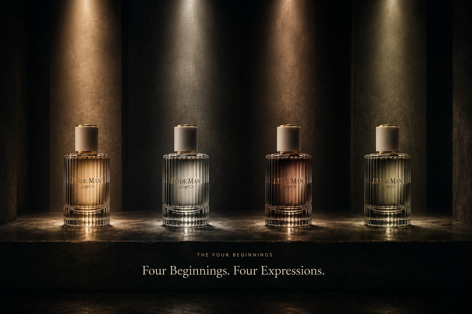 Four L'O DE MAN fragrance bottles presented beneath individual beams of light